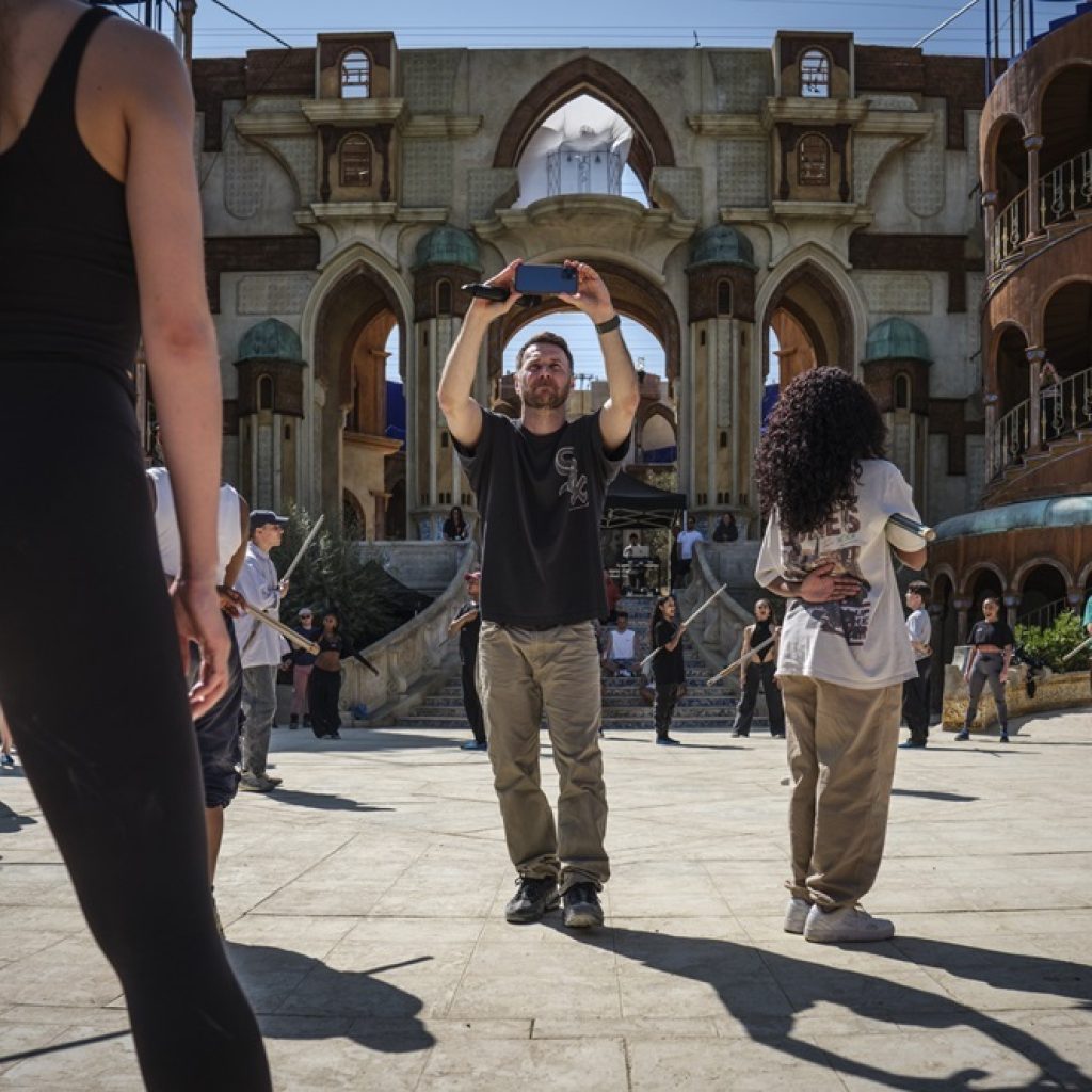 Chris Scott on 'Wicked' set. Photo by Giles Keyte, Universal Pictures.