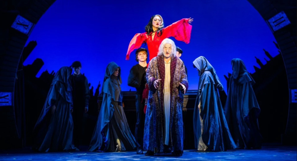 Saki Masuda (in red, center) in 'A Christmas Carol - The Musical.' Photo by Russ Rowland.