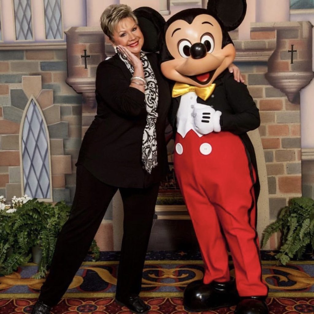 Debi Barr with Mickey Mouse. Photo courtesy of Barr.